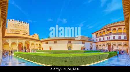 GRANADA, SPAIN - SEPTEMBER 25, 2019: Panorama of Court of Myrtles with a view on Comares Palace and Tower, and the topiary myrtle bushes (Nasrid Palac Stock Photo