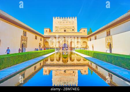 GRANADA, SPAIN - SEPTEMBER 25, 2019: The medieval Court of Myrtles (Nasrid Palace, Alhambra) with Comares Tower and palace arcade, reflected in mirror Stock Photo