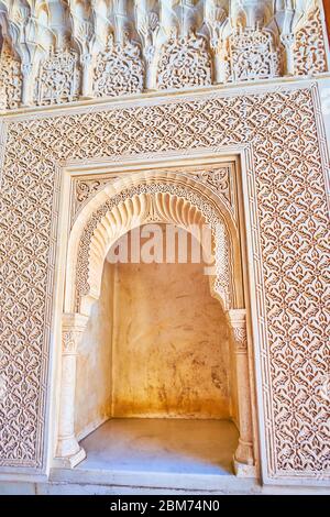 GRANADA, SPAIN - SEPTEMBER 25, 2019: The scenic niche in porch of Palace of Lions (Nasrid Palace, Alhambra) is covered with fine sebka decor, traditio Stock Photo