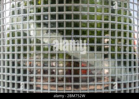 Curved traslucent glass brick wall for background. Exterior wall of staircase Stock Photo