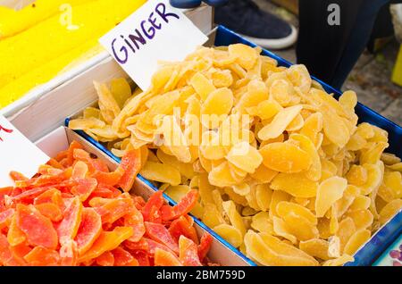 Colored sweet slices of candied fruit. Various dried fruits and eastern sweets on market. Selective focus. Stock Photo