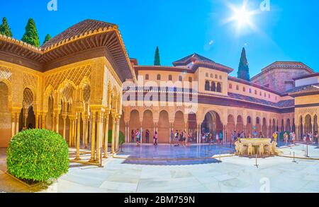 GRANADA, SPAIN - SEPTEMBER 25, 2019: Enjoy the architectural ensemble of Palace of Lions (Nasrid Palace, Alhambra), walking in picturesque Court of Li Stock Photo