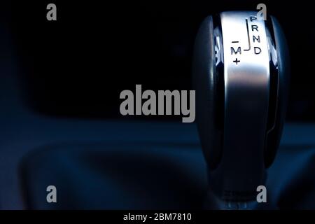 automatic gearshift of a modern car on a dark background, close-up Stock Photo