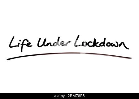 Life Under Lockdown handwritten on a white background. Stock Photo