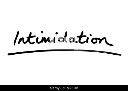 Intimidation handwritten on a white background. Stock Photo