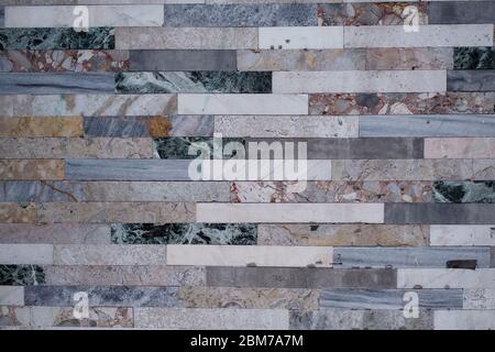 The texture of the wall is lined with marble tiles. Stock Photo