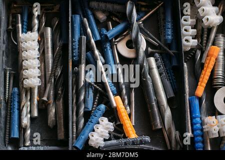Set of tools and different contraptions in a plastic box. Stock Photo