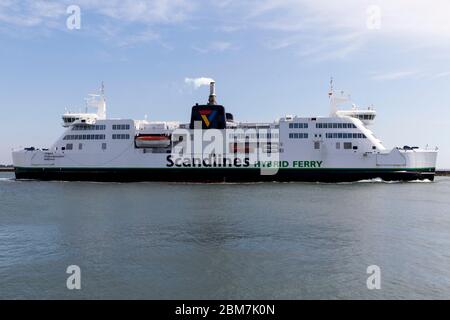 RODBY, DENMARK - MAY 06, 2020:  The Rødby – Puttgarden ferry leaves Rødby Harbor. The Danish – German ferrry connection will be replaced by the Fehmernbelt Tunnel by 2029. The tunnel project begins in 2021 and will cost some 55 bn DKK .The 18 KM tunnel will be the largest in the world of its kind.  Cuerrently Archaeologist at the Lolland-Falster Museum are excavating the landarea next to the tunnel and have revealed a 2.000 years old Iroon Age defence system