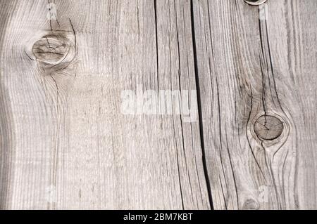 Wooden desk knot. Wood texture plank grain timber background.Knot on a gray board Stock Photo