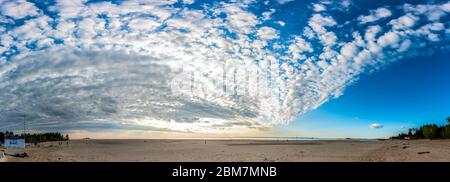 Panorama with beautiful cirrus clouds over the sea Stock Photo