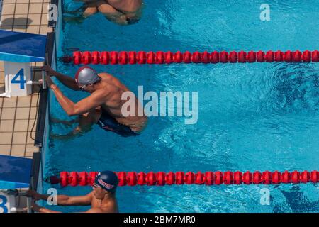 Aaron Peirsol (USA) starting the Men's 100m backstroke heats. 2004 Olympic Summer Games, Athens, Greece. August 15, 2004 Stock Photo