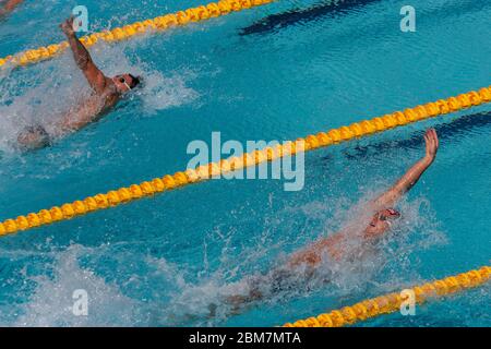 Aaron Peirsol (USA)-R- competing in the Men's 100m backstroke heats. 2004 Olympic Summer Games, Athens, Greece. August 15, 2004 Stock Photo