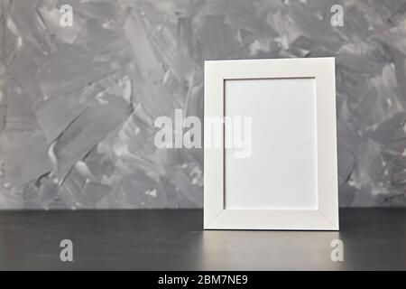 Photo frame on wood table. On gray background with copy space Stock Photo