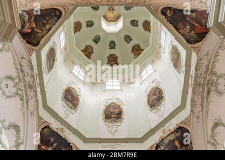 Feb 4, 2020 - Salzburg, Austria: Upward window of onion dome of St Peter Abbey church in rococo floral style mural Stock Photo