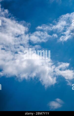 sunny blue sky day with wispy clouds Stock Photo
