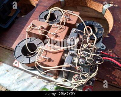 Acoustic filter - crossover, Amphiton 35AC-018 vintage acoustic system. Capacitors and coils on the circuit board. Stock Photo