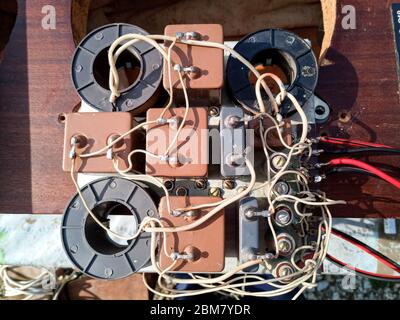 Acoustic filter - crossover, Amphiton 35AC-018 vintage acoustic system. Capacitors and coils on the circuit board. Stock Photo