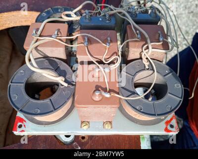 Acoustic filter - crossover, Amphiton 35AC-018 vintage acoustic system. Capacitors and coils on the circuit board. Stock Photo
