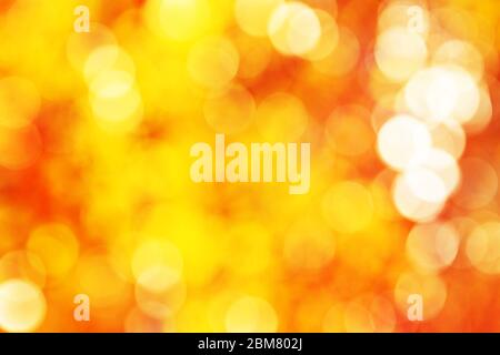 Abstact vibrant golden, yellow, orange circle bokeh background texture Stock Photo
