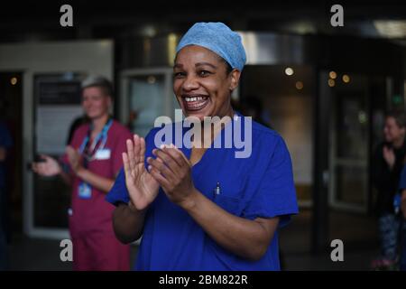 Medical staff outside the Chelsea and Westminster Hospital, London, join in the applause during Thursday's nationwide Clap for Carers to recognise and support NHS workers and carers fighting the coronavirus pandemic. Stock Photo