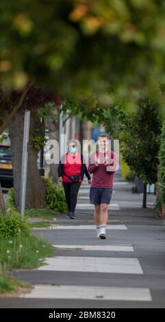 Merton Park, London, UK. 7 May 2020. Residents and neighbours of a leafy south London street clap for NHS and Carers at 8.00pm on a warm evening on day 45 of the Coronavirus lockdown. Credit: Malcolm Park/Alamy Live News. Stock Photo