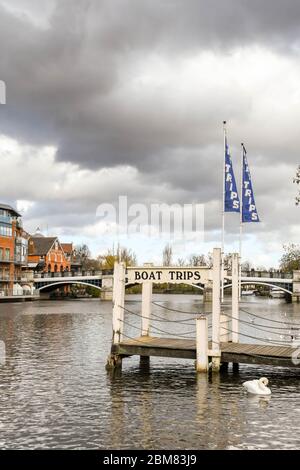 RIVER THAMES, WINDSOR, ENGLAND - NOVEMBER 2018: Jetty for tourist river cruise boats on the River Thames in Windsor.