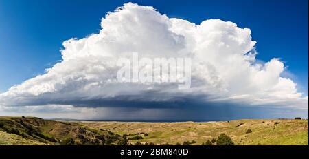 Scenic landscape panaroma of a thunderstorm cumulonimbus cloud over the Nebraska Sandhills Stock Photo