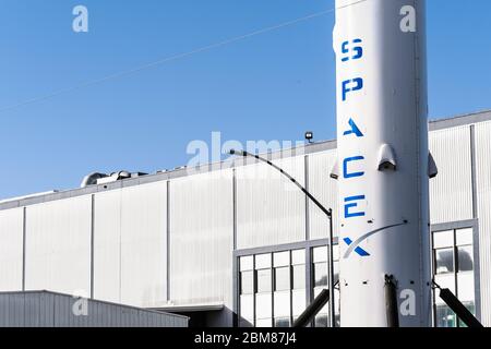 Dec 8, 2019 Hawthorne / Los Angeles / CA / USA - SpaceX (Space Exploration Technologies Corp.) headquarters; Falcon 9 rocket displayed in the front; S Stock Photo