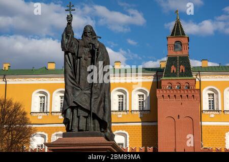 View  of the monument to Patriarch Hermogenes in Alexander Garden and the Middle Arsenal tower of the Kremlin in the downtown of Moscow, Russia Stock Photo