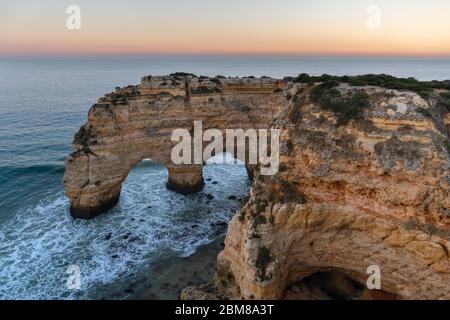 Amazing seascape at sunset at Marinha Beach in the Algarve, Portugal. Landscape with strong colors of one of the main holiday destinations in europe.