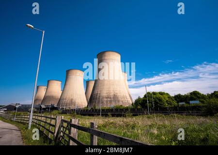 Power station cooling towers next to a railway line Stock Photo