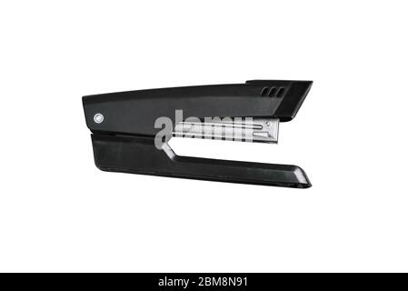 Black office stapler isolated on a white background Stationery for paper stitching. Close-up of the stapler Stock Photo