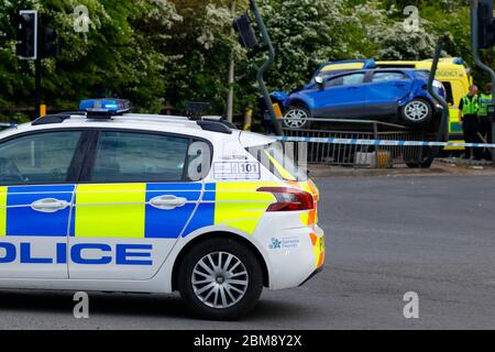A car is left on it's side, after colliding with traffic lights at a junction on Barnsdale Road in Allerton Bywater. The occupants escaped unharmed Stock Photo