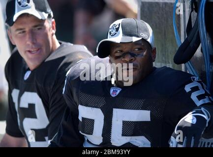 Oakland Raiders Charlie Garner (left) and Jerry Rice (rt) celebrate on the  podium after the Raiders are presented the AFC Championship Trophy  following the 41-24 thrashing of the Tennessee Titans at the