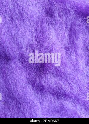 lilac texture woolen background. abstract textile background of carded wool for needle felting in light purple color Stock Photo