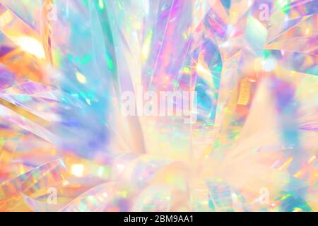 Festive cheerful abstract image texture of holographic foil ribbon in candy colors with sparkling light reflections Stock Photo