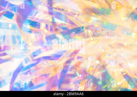 Abstract gold and blue elegant festive image background of stylish holiday transparent holographic ribbon foil streaks with gleaming light sparkle eff Stock Photo