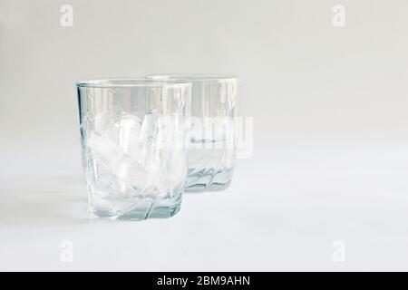 https://l450v.alamy.com/450v/2bm9ahn/tumbler-full-of-ice-with-a-second-glass-half-full-of-water-ice-melted-virginia-united-states-color-2bm9ahn.jpg