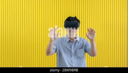 Senior Asian man using tablet and virtual reality simulator playing games in living room and feeling happy . Lifestyle Senior family at home concept. Stock Photo