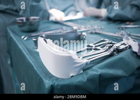 sterile surgical instruments are on a table during an operation Stock Photo