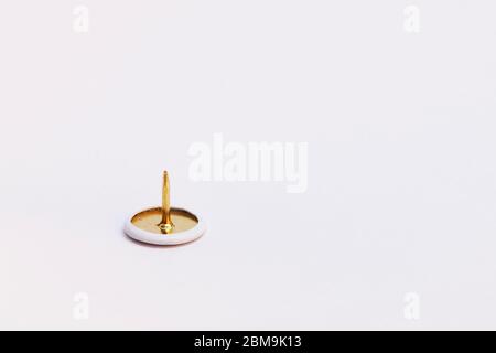 a sharp thumbtack on white background Stock Photo