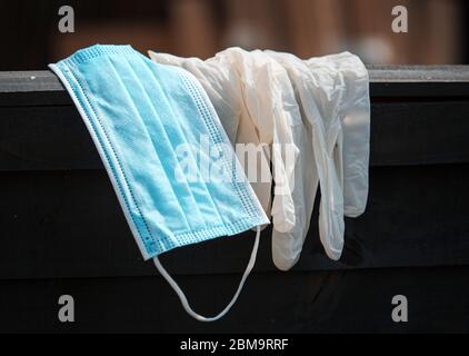 Used and discarded medical personal protective equipment also known as PPE Stock Photo
