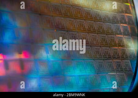Close up of a silicon wafer of SIM computer chips. Stock Photo