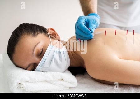 Acupuncture Skin Treatment For Women In Face Mask Stock Photo