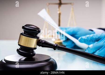 Judge Or Lawyer In Courtroom With Gavel. Court Litigation Stock Photo