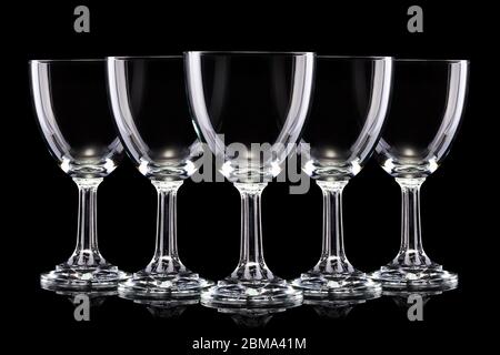 Set of empty glasses of light beer with foam isolated on a black background Stock Photo