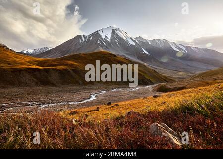 Landscape of Ozerniy peak in Tian Shan Mountains at sunset in Kazakhstan Stock Photo