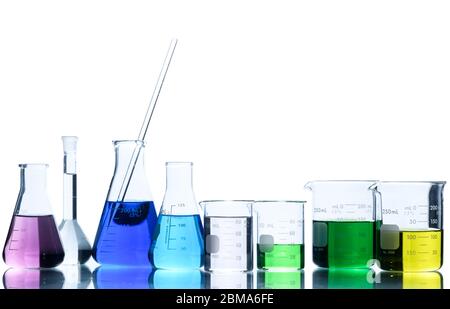 Laboratory glassware with liquids of different colors, Flasks and measuring beaker for science experiment in laboratory isolated on white background a Stock Photo