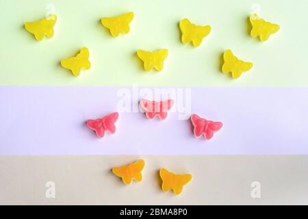 Colorful flat lay butterfly candy jellies Stock Photo