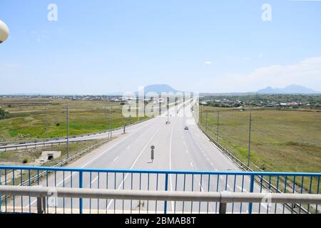 The road crossing is adjacent to the secondary road. Stock Photo